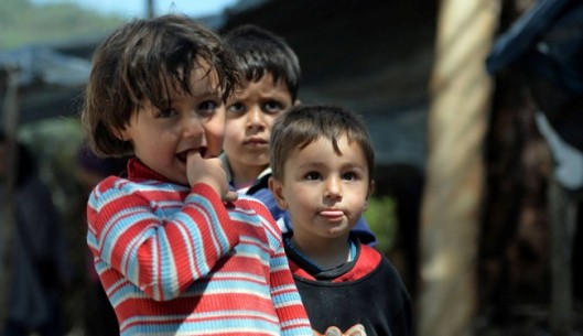 Syrian children are seen at a make-shift refugee camp some kilometers away from the Syria-Turkey border on April 23, 2013.